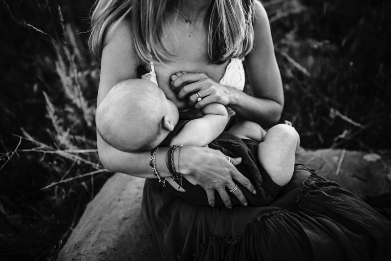 Wellsville NY Family & Newborn Photographer, black and white of mother breastfeeding baby boy