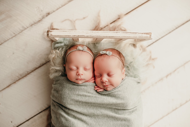 Wellsville NY Family & Newborn Photographer, baby twins asleep in a miniature bed