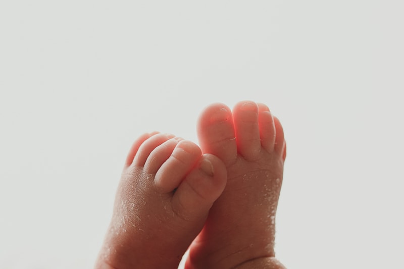 Wellsville NY Family & Newborn Photographer, detail shot of baby's feet