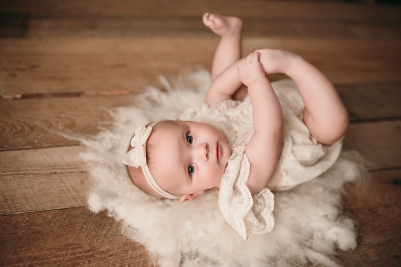 Wellsville NY Family & Newborn Photographer, baby girl laying on her back