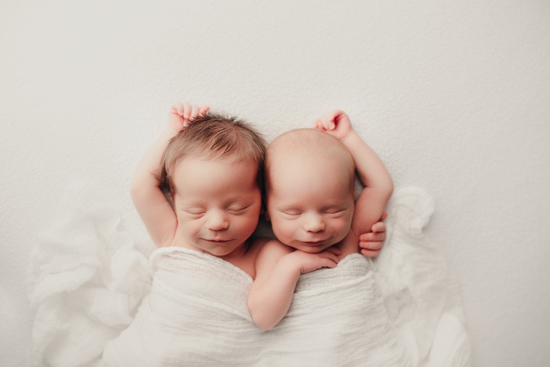 Wellsville NY Family and Newborn Photographer, two babies sleeping together with arms around each other