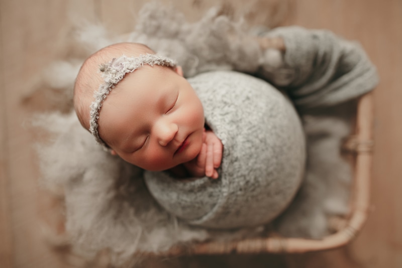 Wellsville NY Family and Newborn Photographer, sleep baby wrapped in light grey fabric